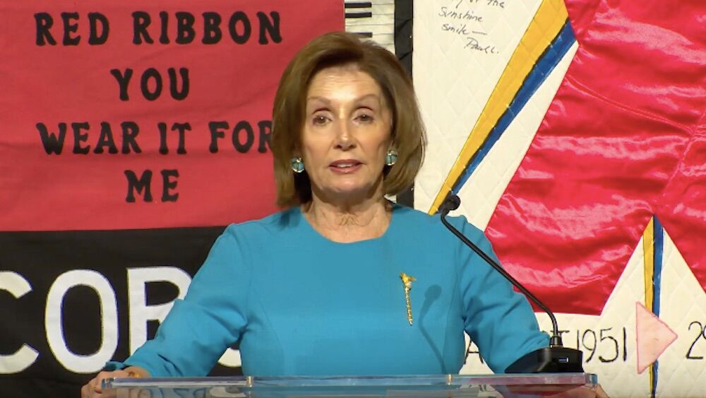 Democratic House Speaker Nancy Pelosi speaks in front of the AIDS Quilt during a November 20, 2019 announcement.