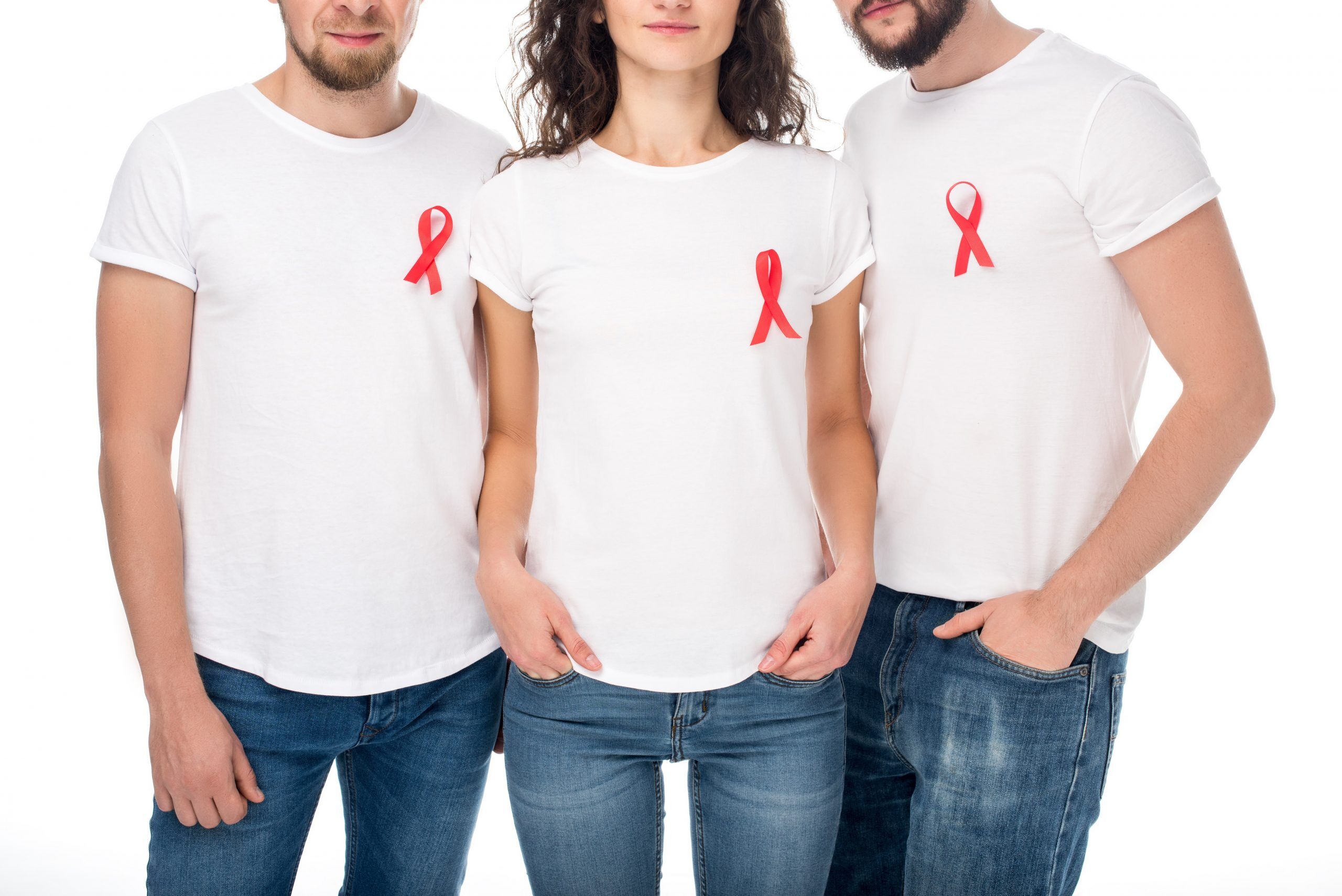 Three people with red ribbons