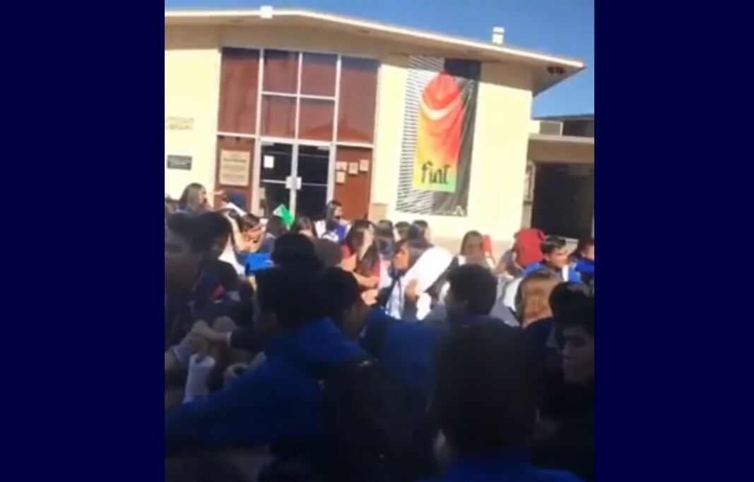 Students sat outside of Bishop Amat Memorial High School on Friday in protest of how the school treated a lesbian student.