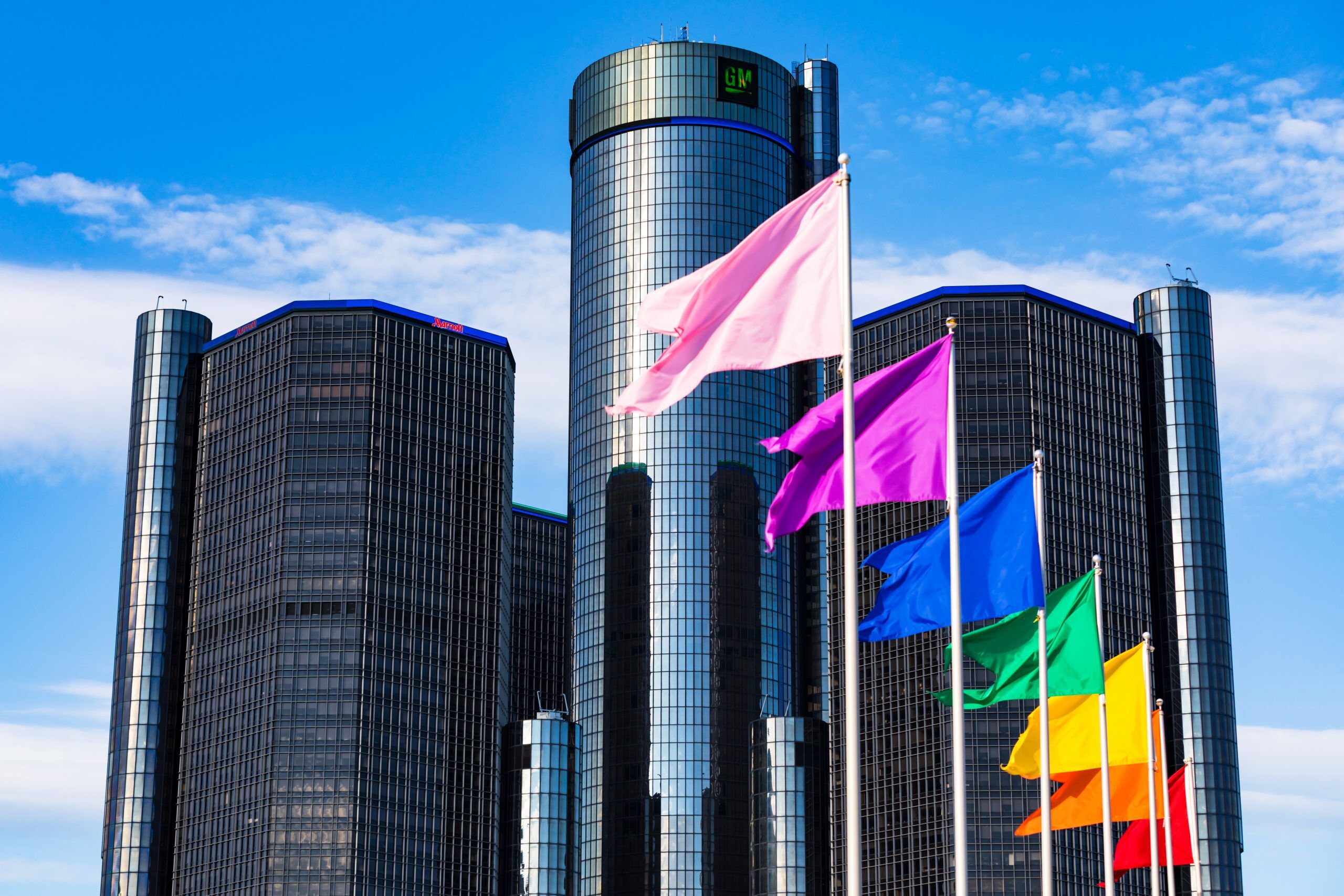 June 23, 2019. GM Renaissance Center in the foreground Rainbow Flags in Observance of Gay Pride month in Downtown Detroit, Michigan, United States. Selective focus.
