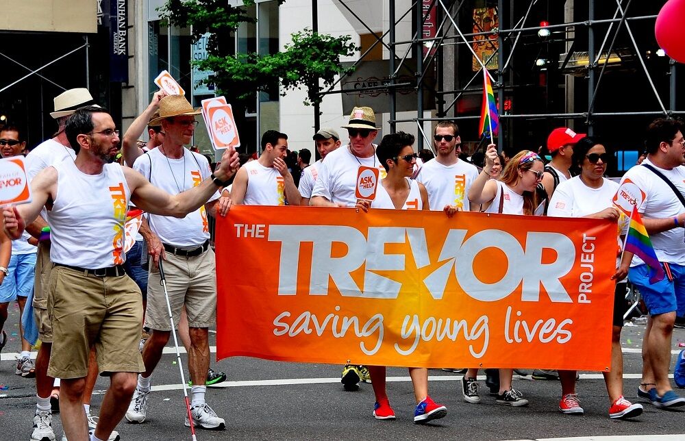 June 29, 2013, New York City: Members of The Trevor Project with their orange banner marching in the 2013 Gay Pride Parade on Fifth Avenue