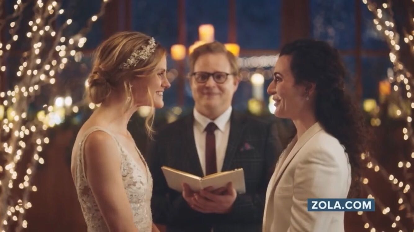 The same-sex couple featured in a promotional ad for Zola.com pulled by Hallmark Channel.