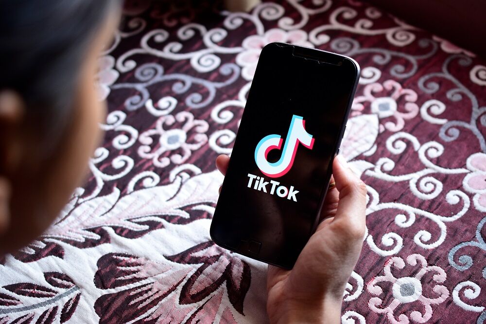 A phone with the TikTok logo