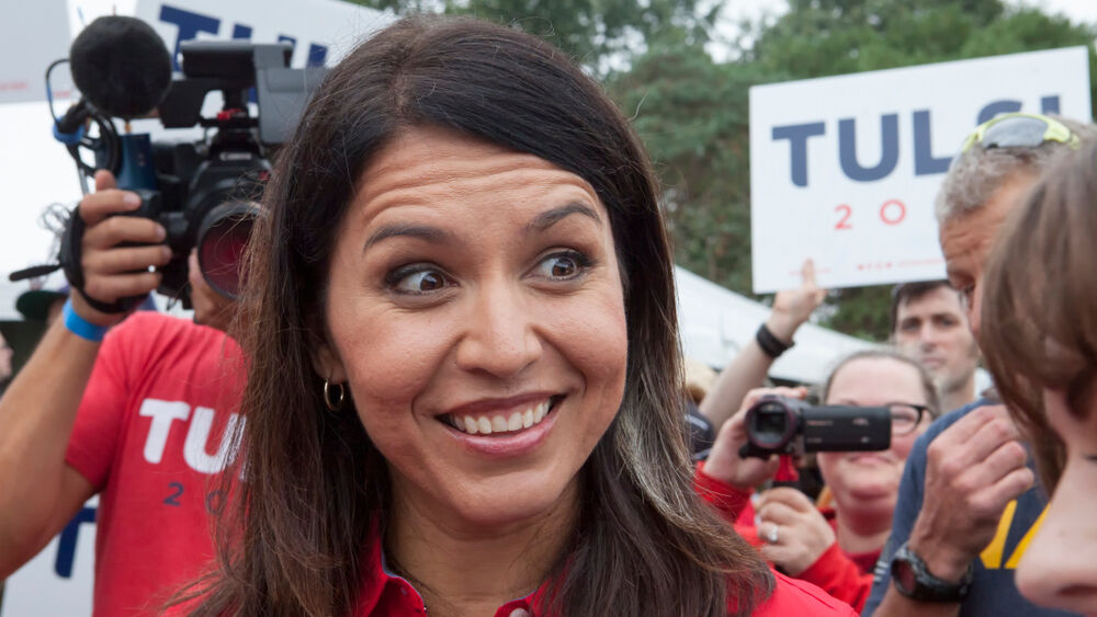 Tulsi Gabbard is a smiling woman who is running as a possible Democratic Presidential candidate