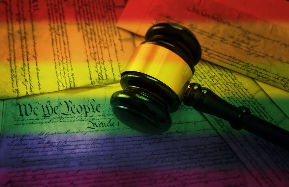 Gavel with rainbow and justice documents