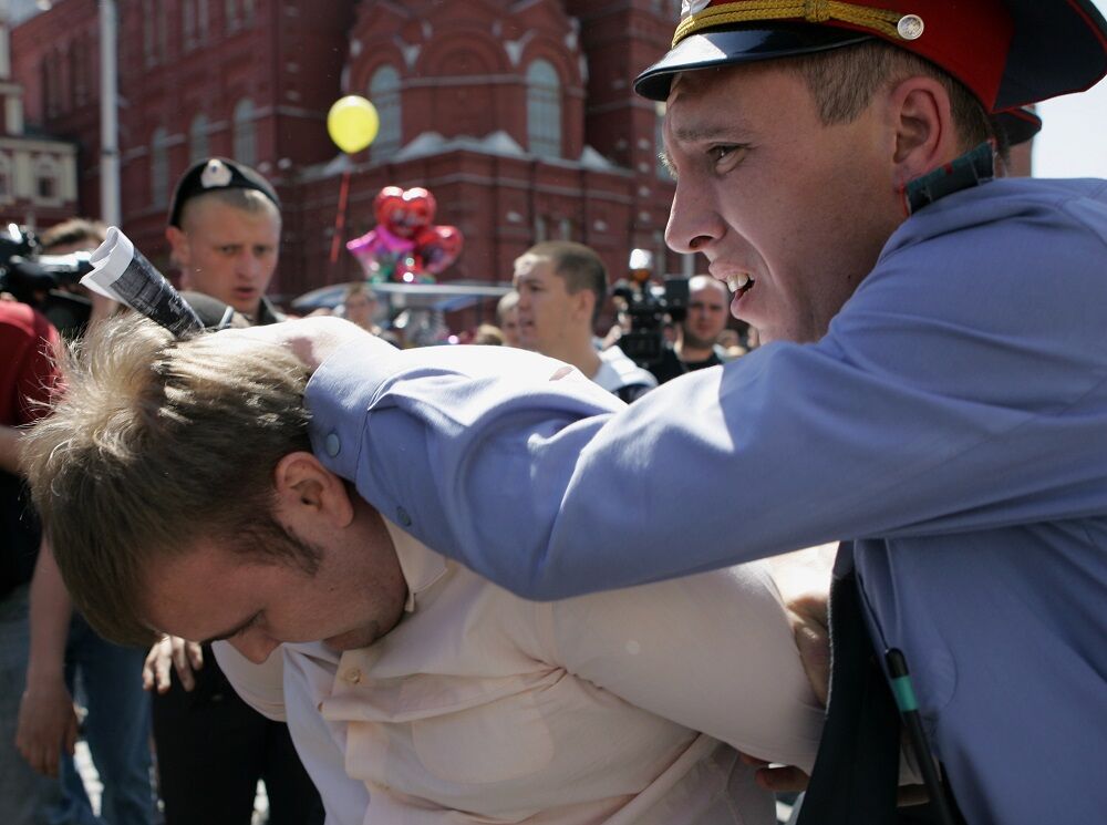 Russian police detain a gay rights activist during an attempt to hold the unauthorized gay pride parade on May 28, 2011 in Moscow