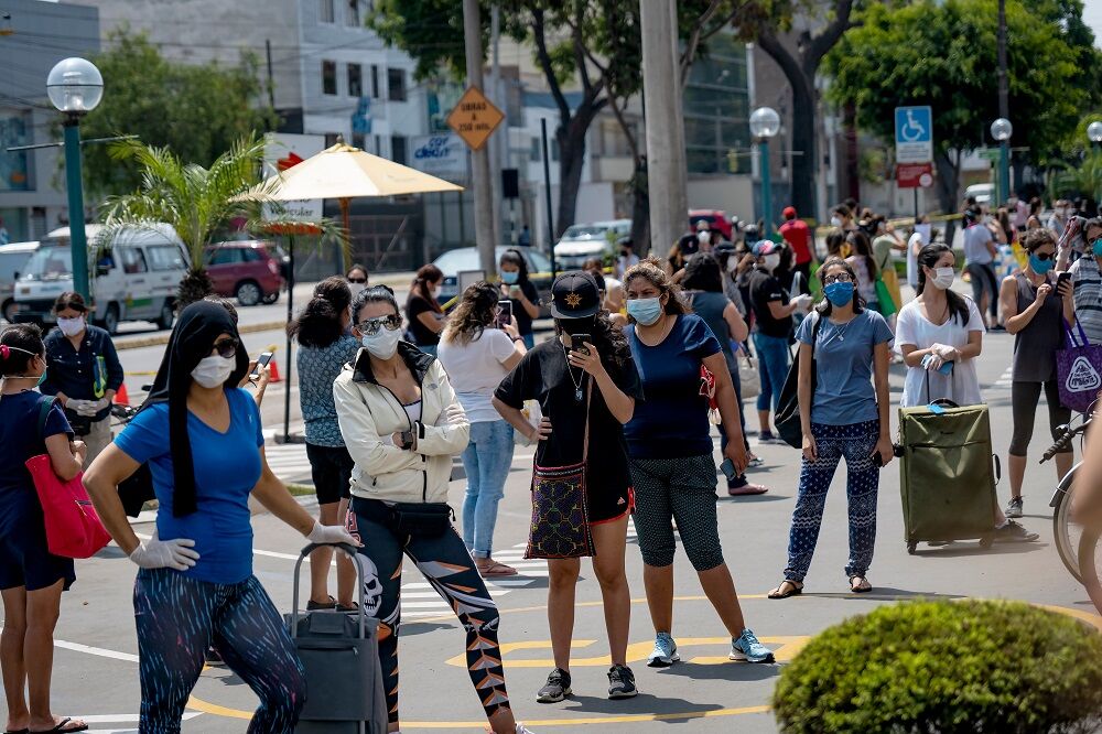 A crowded street on a women's day in Peru, which implemented the same gendered policy.