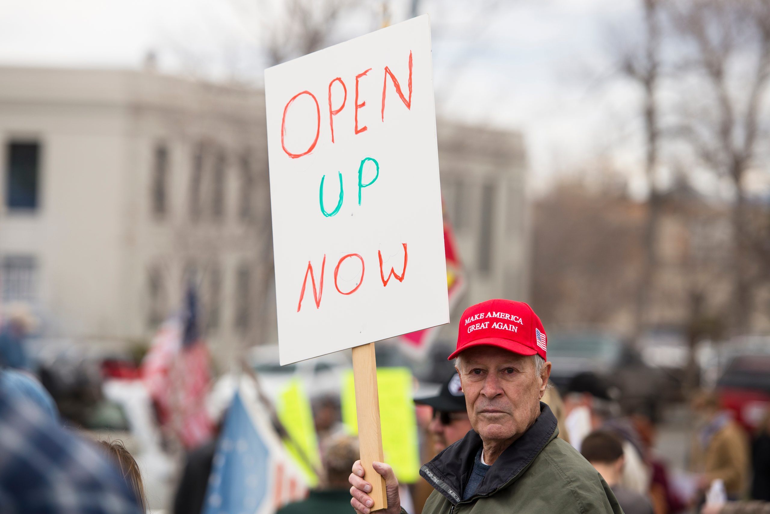 Helena, Montana - April 19, 2020: Protestor holding sign at a protest rally over the shutdown and stay at home orders due to cautions about Coronavirus.