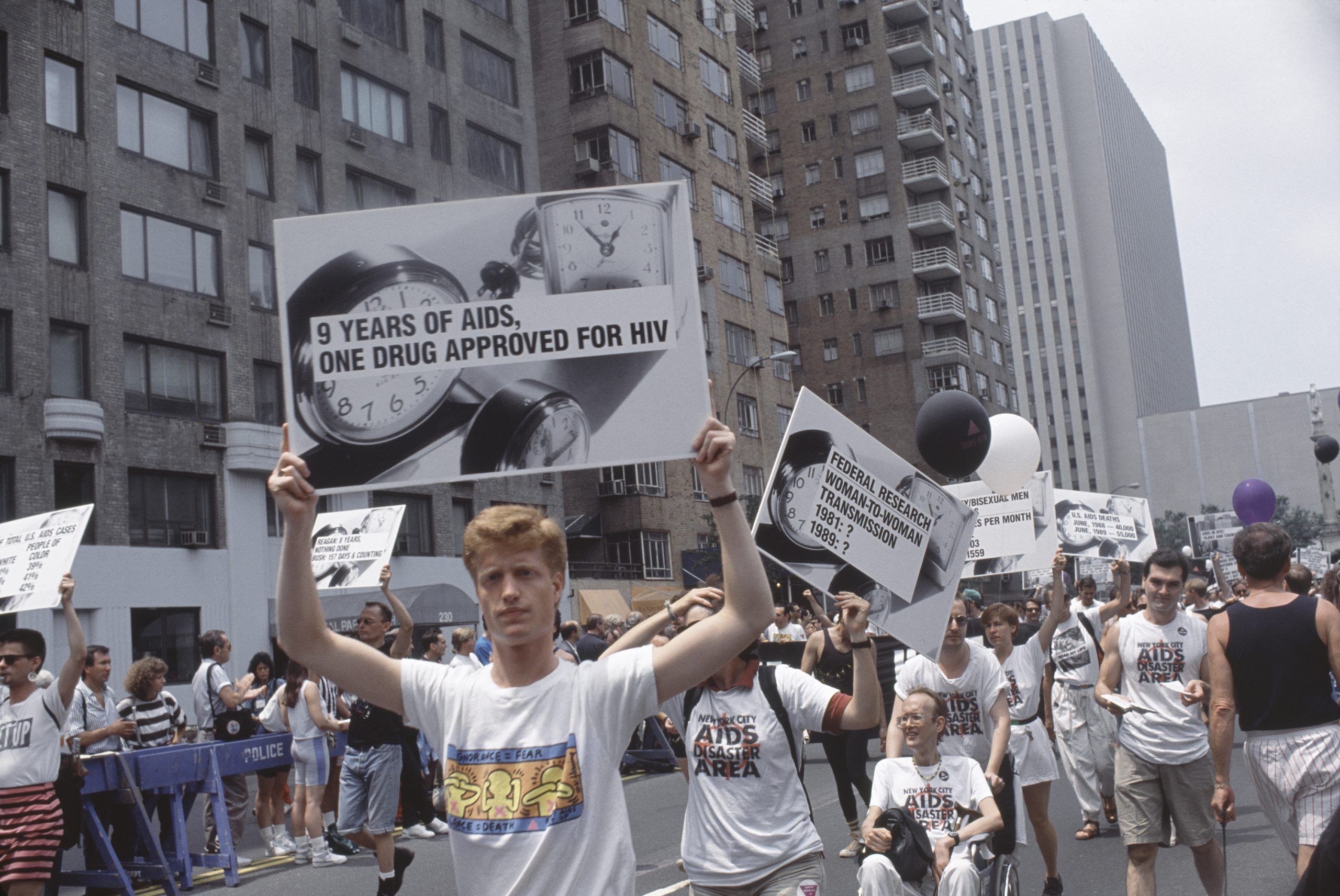 New York, New York, USA - Sunday, June 25, 1989: Marchers at the Lesbian and Gay Pride Parade, Sunday, June 25, 1989 in New York, New York, USA carry signs '9 years of AIDS, One drug approved for HIV.'