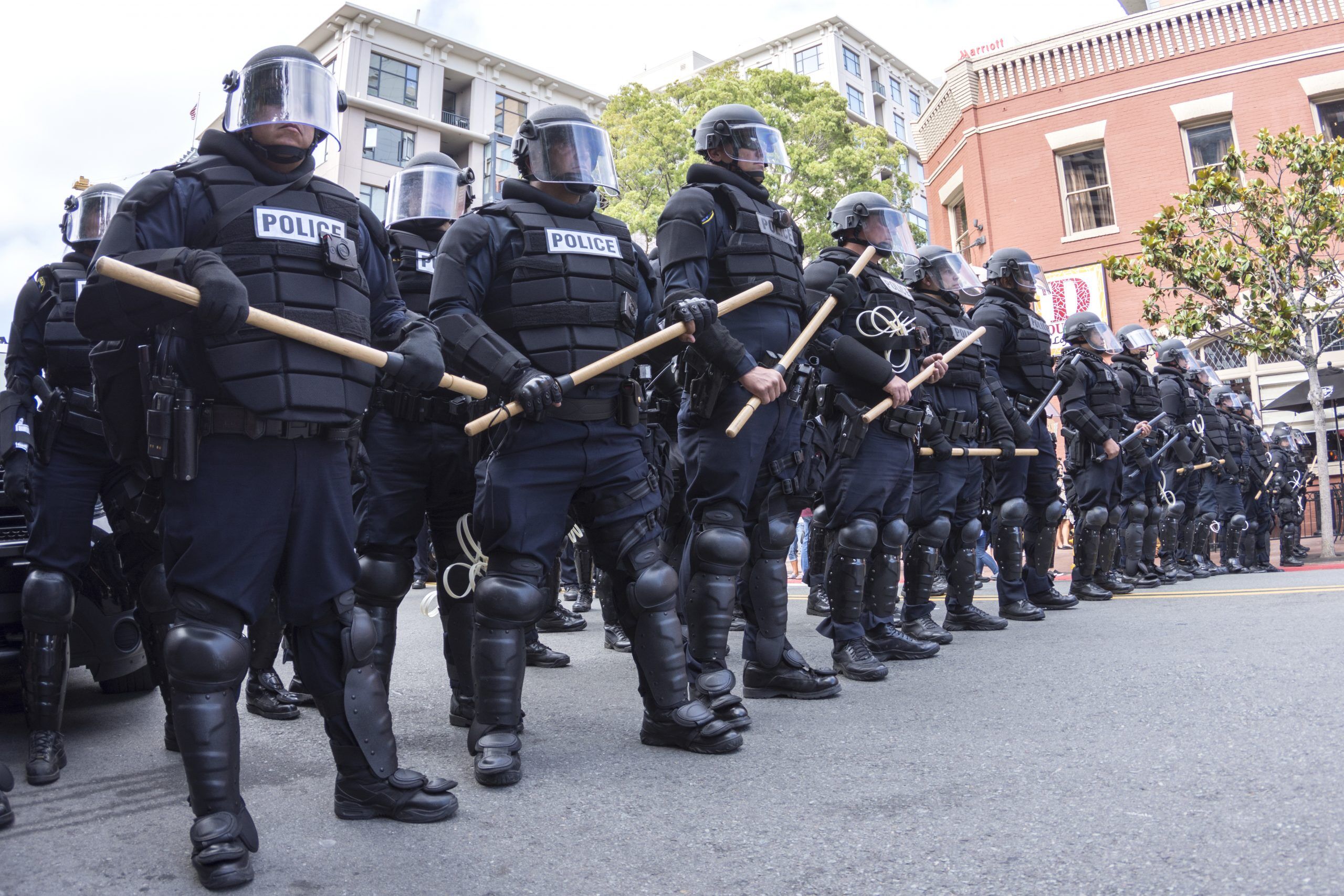 MAY 27, 2016: Riot police in full tactical gear stand ready to confront protesters at a Trump rally at the San Diego Convention Center