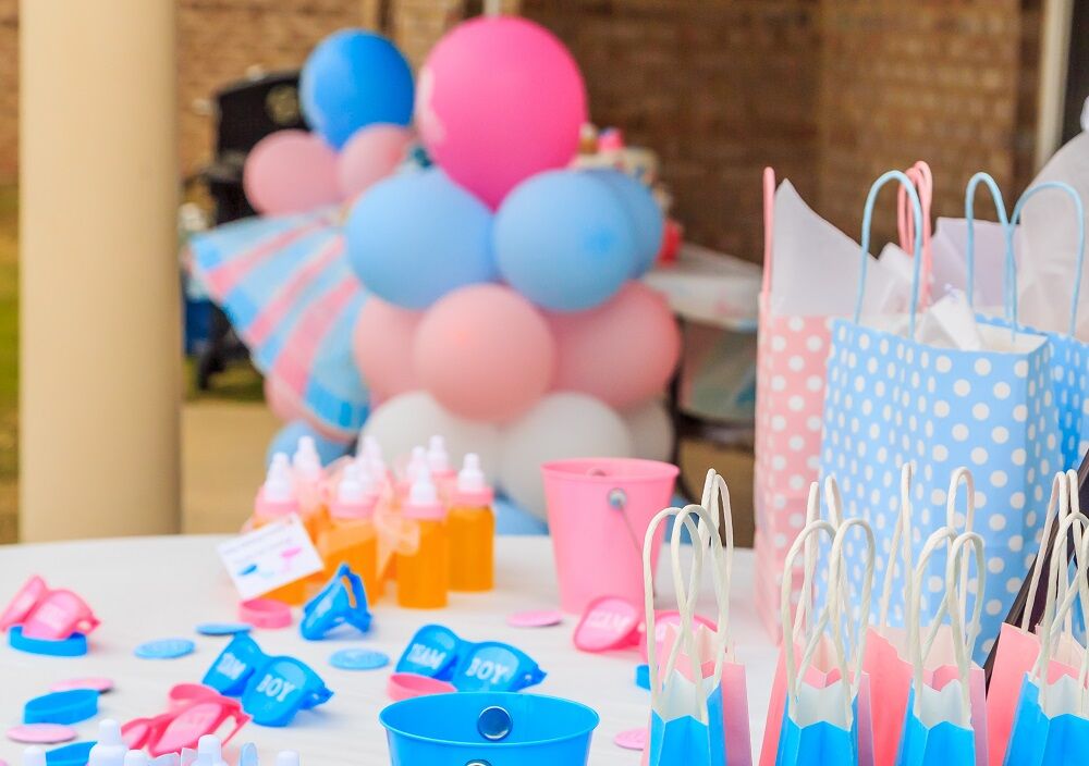 A gender reveal party stock image that uses trans flag colors, probably by accident