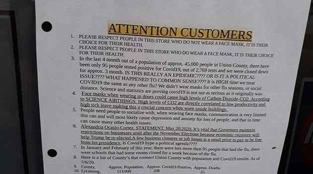 A portion of the sign posted to the front door of Wengers Discount Grocery