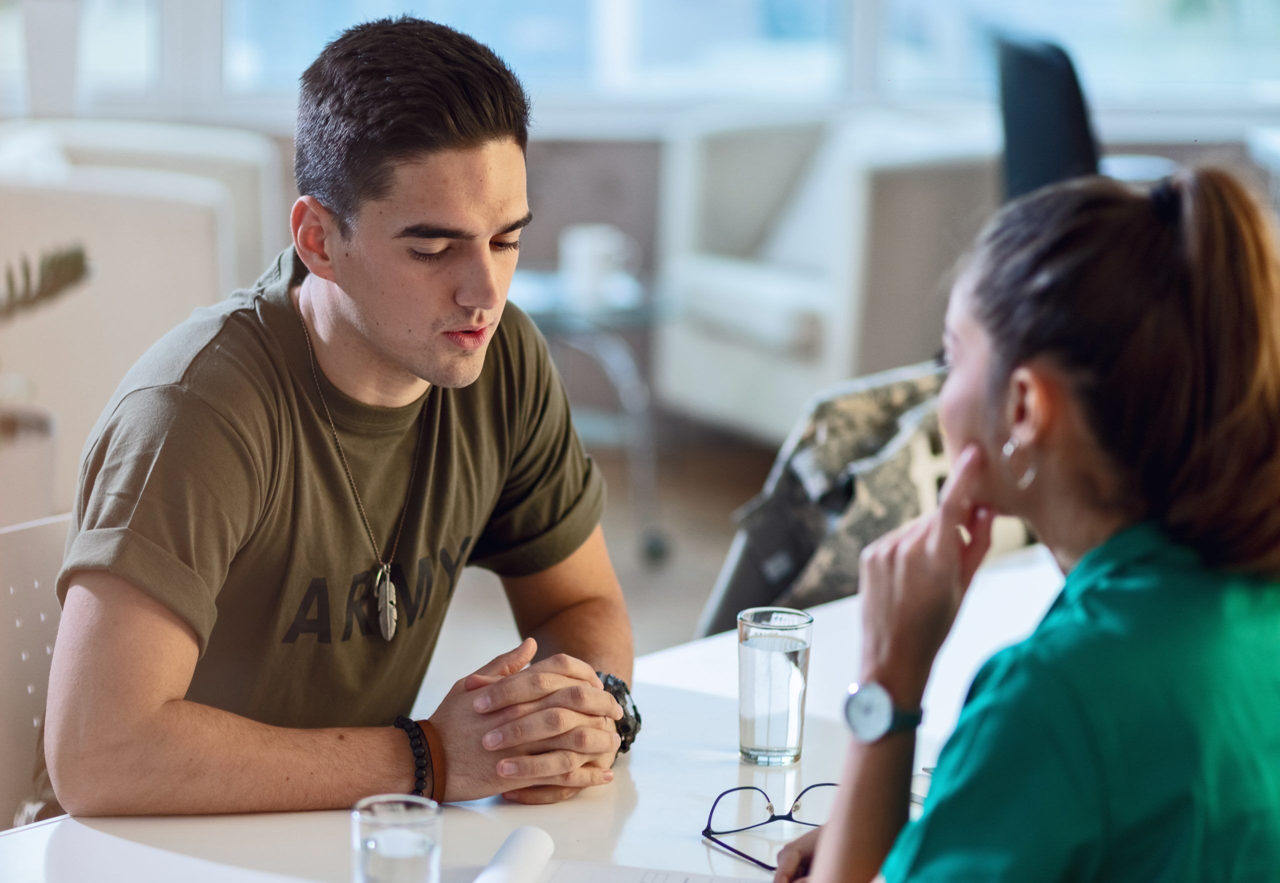 A soldier talking to a doctor. It's just a stock image, it's not deep.