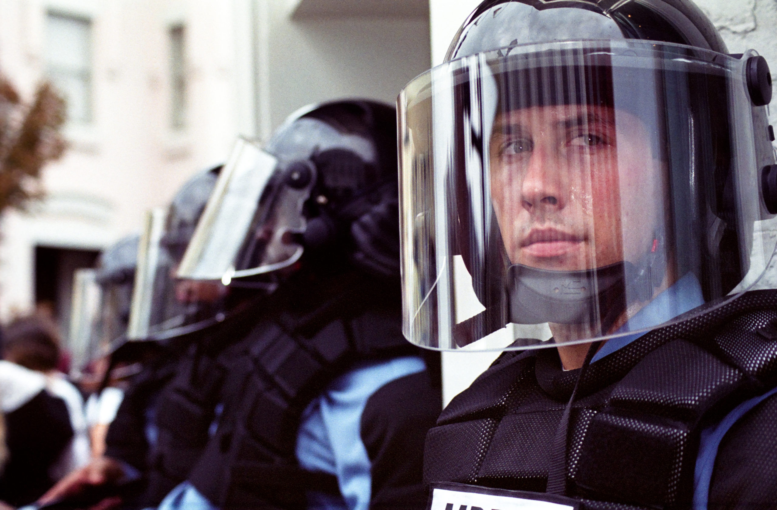 Police in full riot gear and batons guard Gap stores during anti-sweatshop protests on Sept. 27, 2002 in Washington, DC.