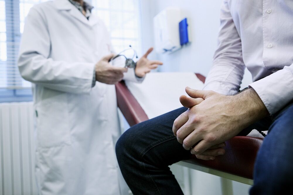 A doctor and a patient in an exam room