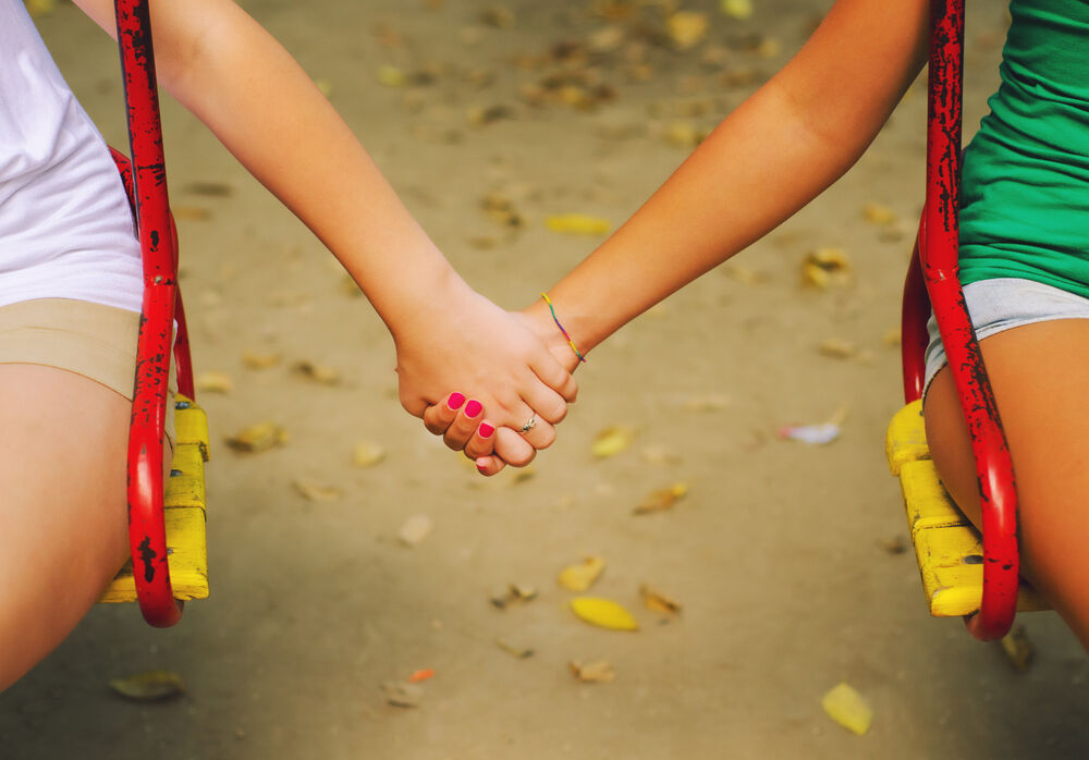 Girls holding hands