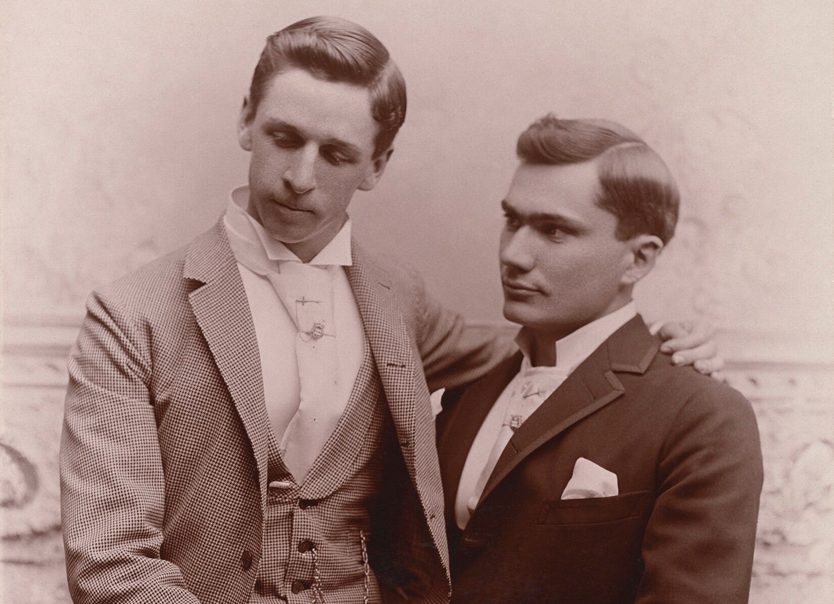 Two men pose in the late 1800s
