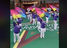 An LGBTQ marching band performs during the Thanksgiving Day Parade for the first time in history