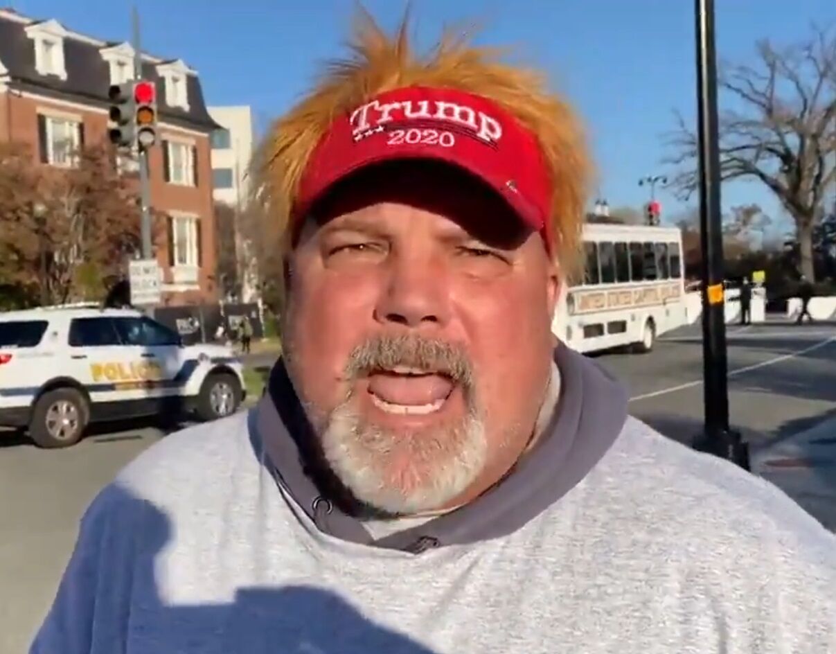 The man in the MAGA hat