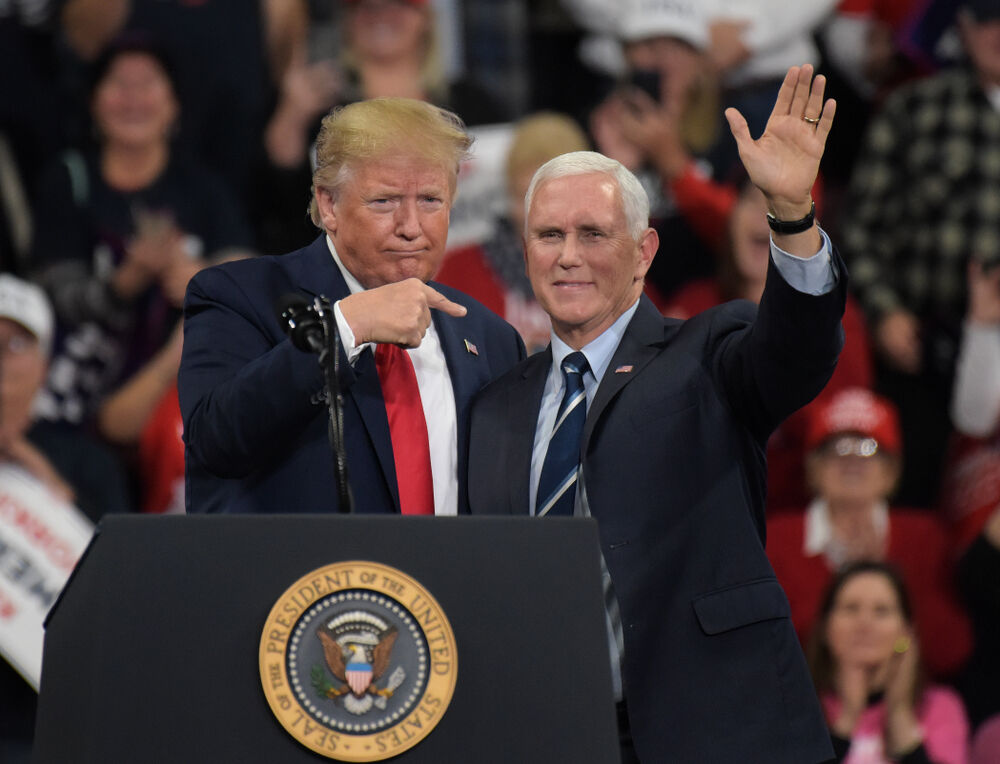 President Donald Trump, left, appears with vice-president Mike Pence, right, during a rally Dec. 10, 2019, at Giant Center in Hershey, PA.