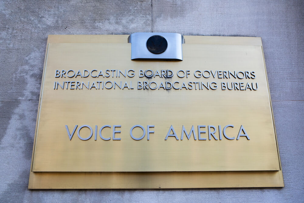 WASHINGTON, DC - JUNE 24, 2019: Sign for the Voice of America at the Wilbur J. Cohen Federal Building. VOA is the largest U.S. international broadcaster.