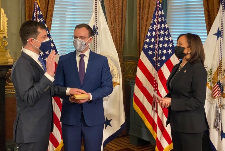 Pete-Buttigieg-Kamala-Harris-Chasten-Swearing-In Pete Buttigieg getting sworn in by Kamala Harris with Chasten Buttigieg by his side.