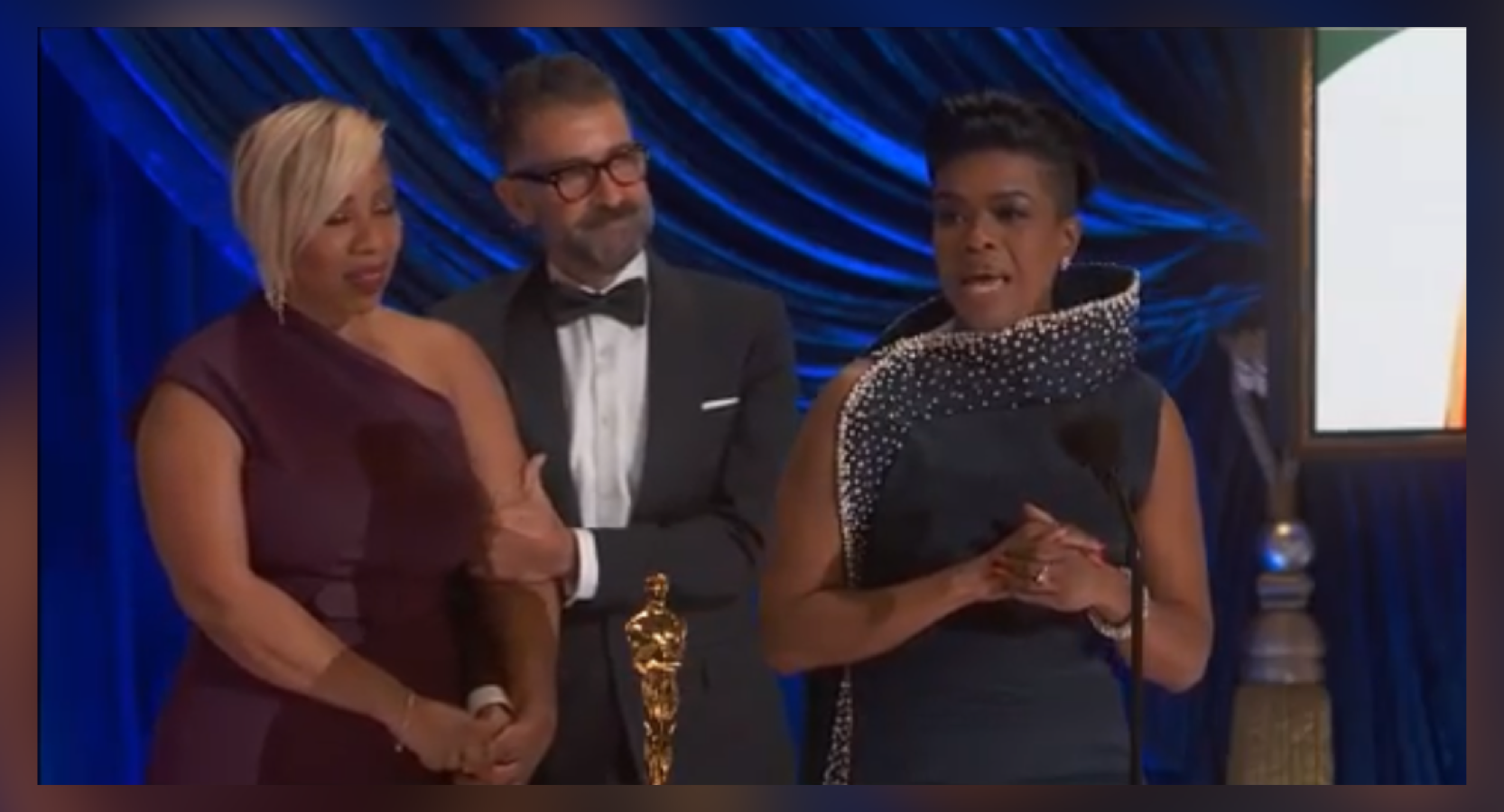 Mia Neal (right) accepting the Academy Award for Hair and Makeup alongside Jamika Wilson and Sergio Lopez-Rivera
