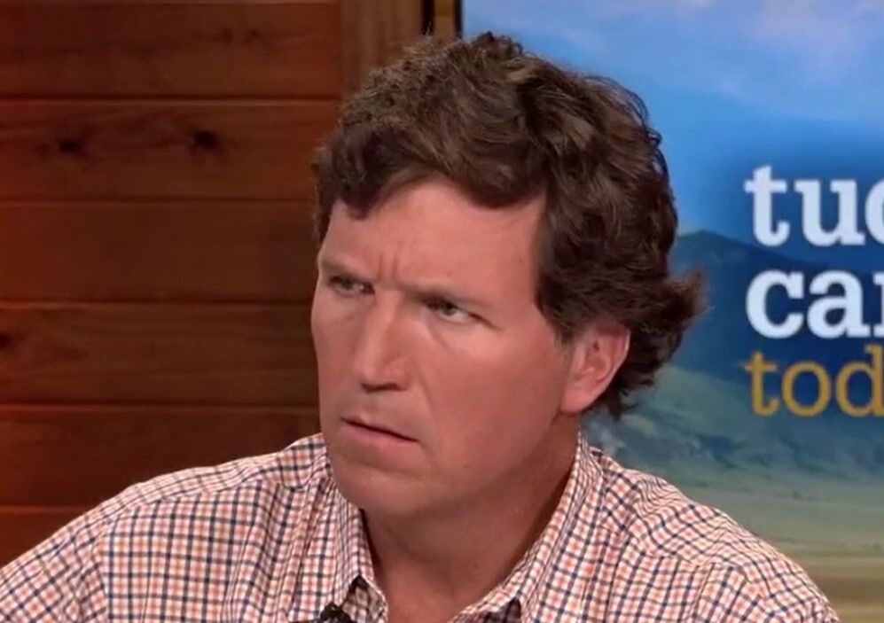 Tucker Carlson with his trademark "confused" face