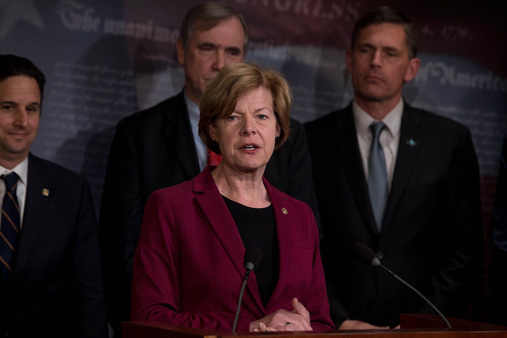 Sen. Tammy Baldwin speaking alongside other Senators at a press conference in 2019.