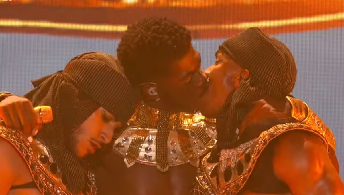 Lil Nas X kissing one of his performers at the 2021 BET Awards on June 27, 2021