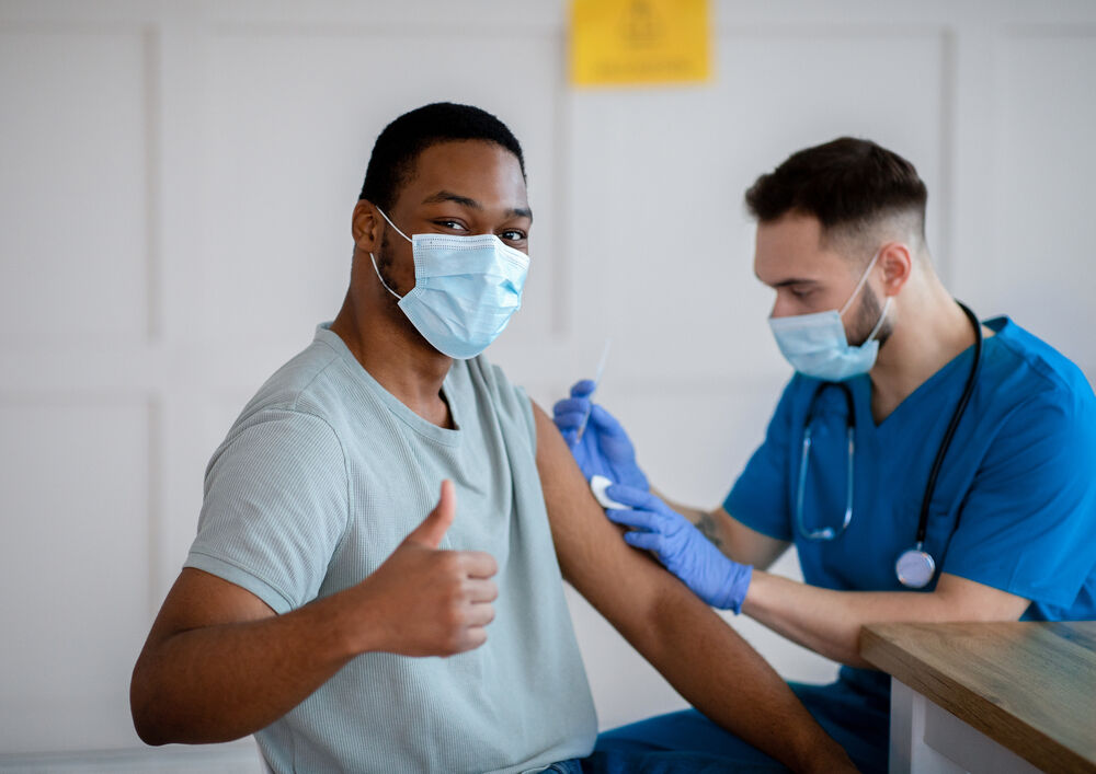 a guy getting vaccinated