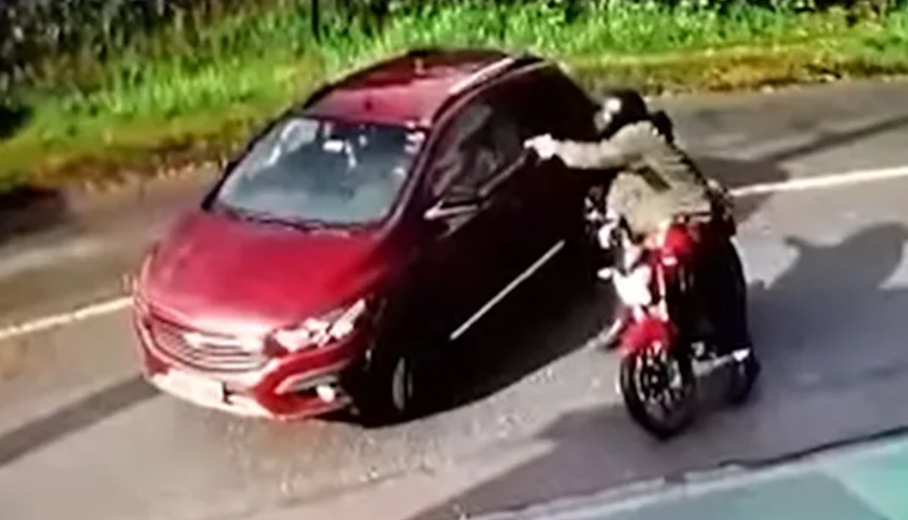 The gunman shooting Ana Paula Campestrini's car.