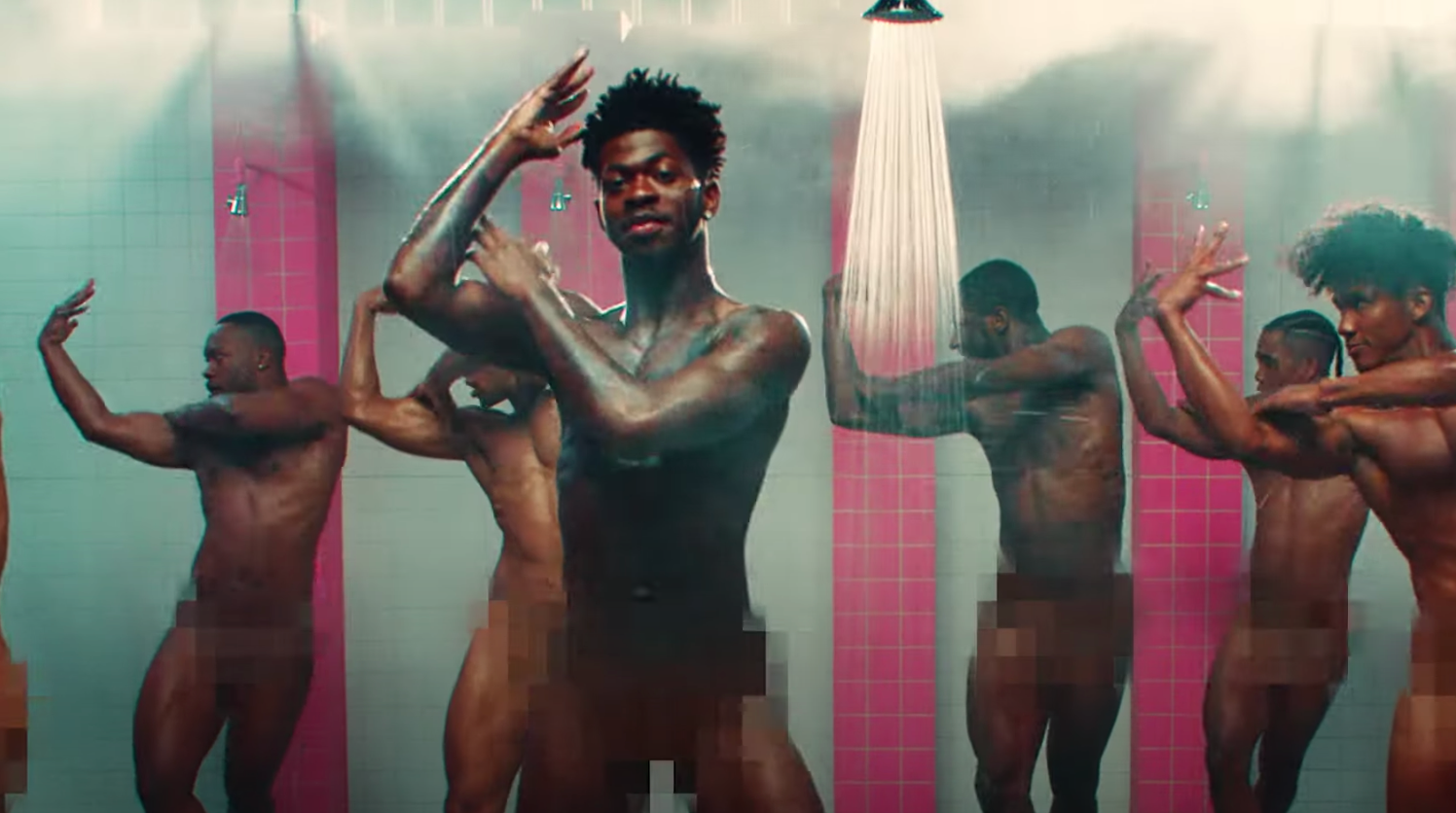 Lil Nas X dances in a prison shower in his video for "Industry Baby."