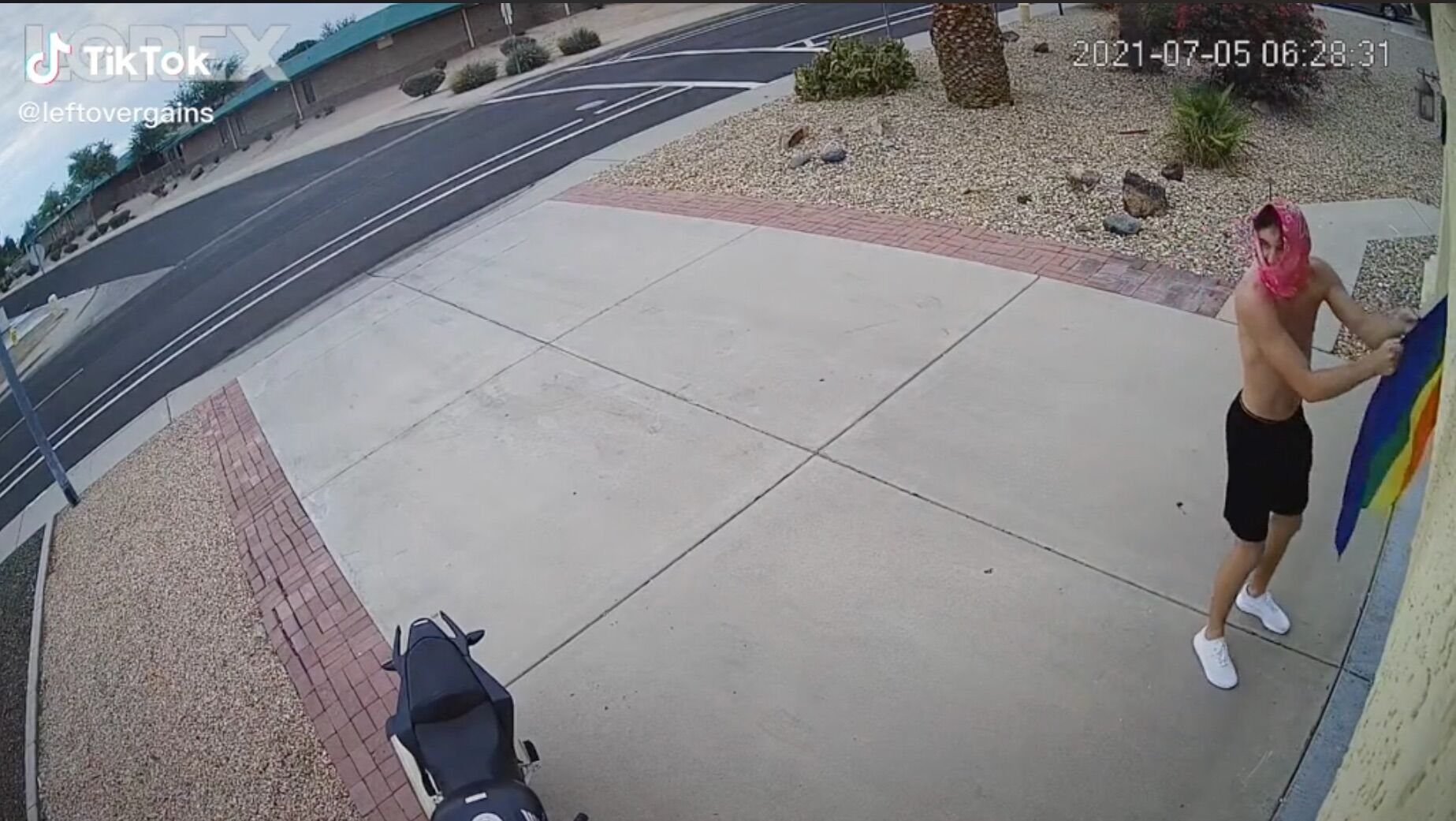 Watch this teenager fail miserably when he tries to rip a Pride flag off a woman’s garage