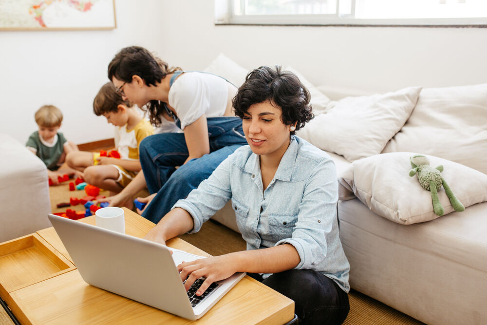 lesbian couple with one working at home