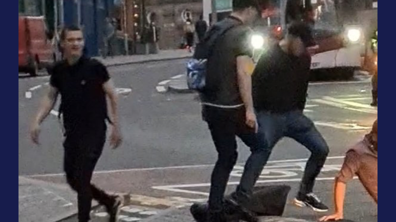 Three of the four alleged assailants as they continue attacking the victim