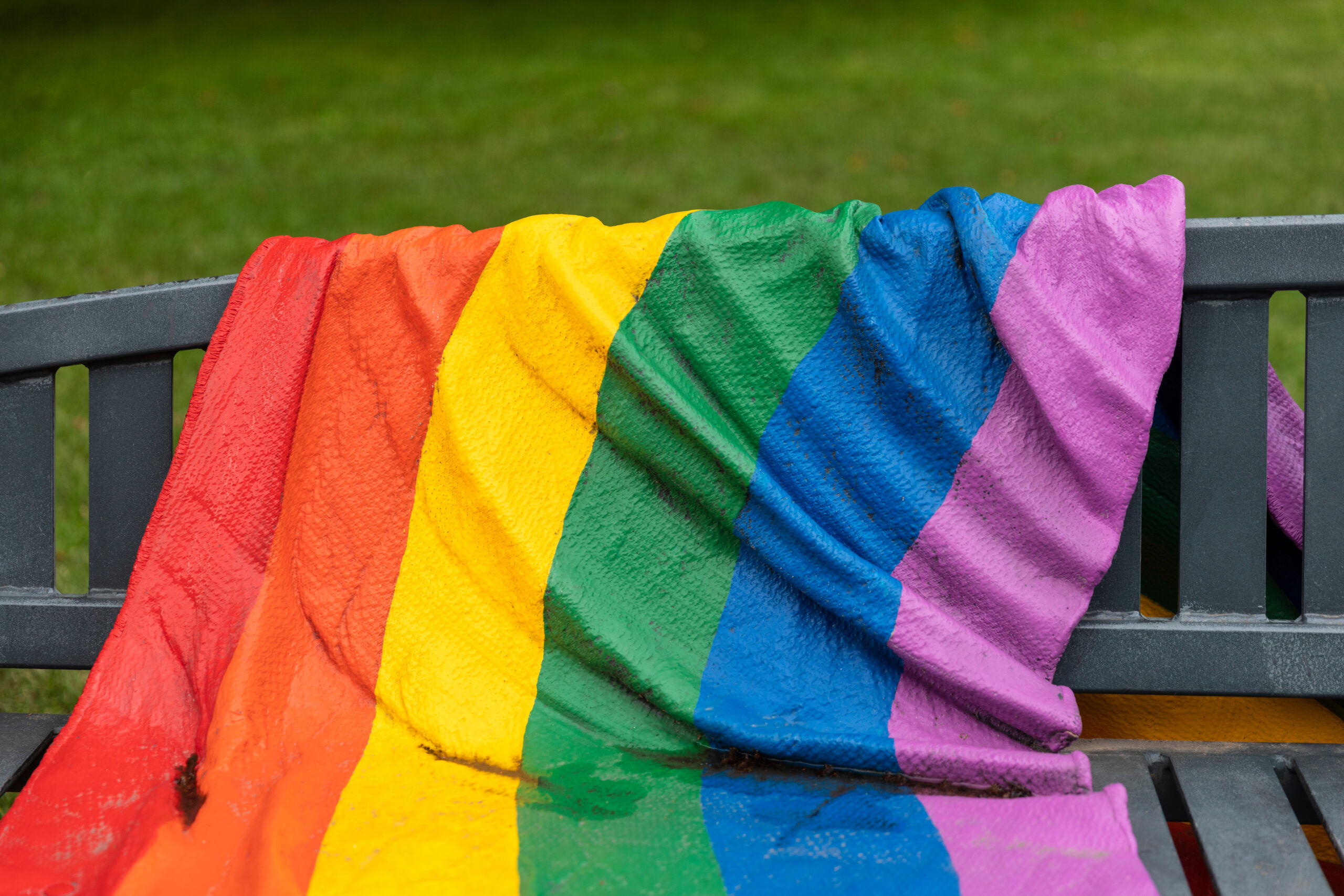 rainbow flag on a bench