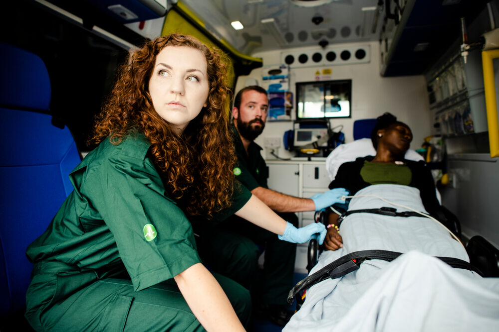 Ambulance with patient and EMTs