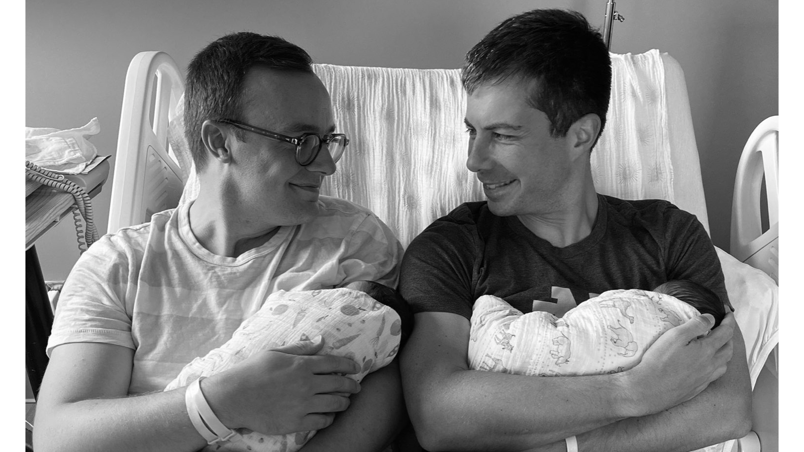 Chasten (left) and Pete Buttigieg (right) holding their newborn children