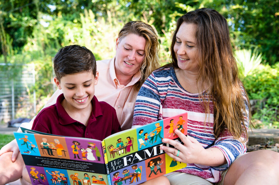 Two Moms Reading with Son