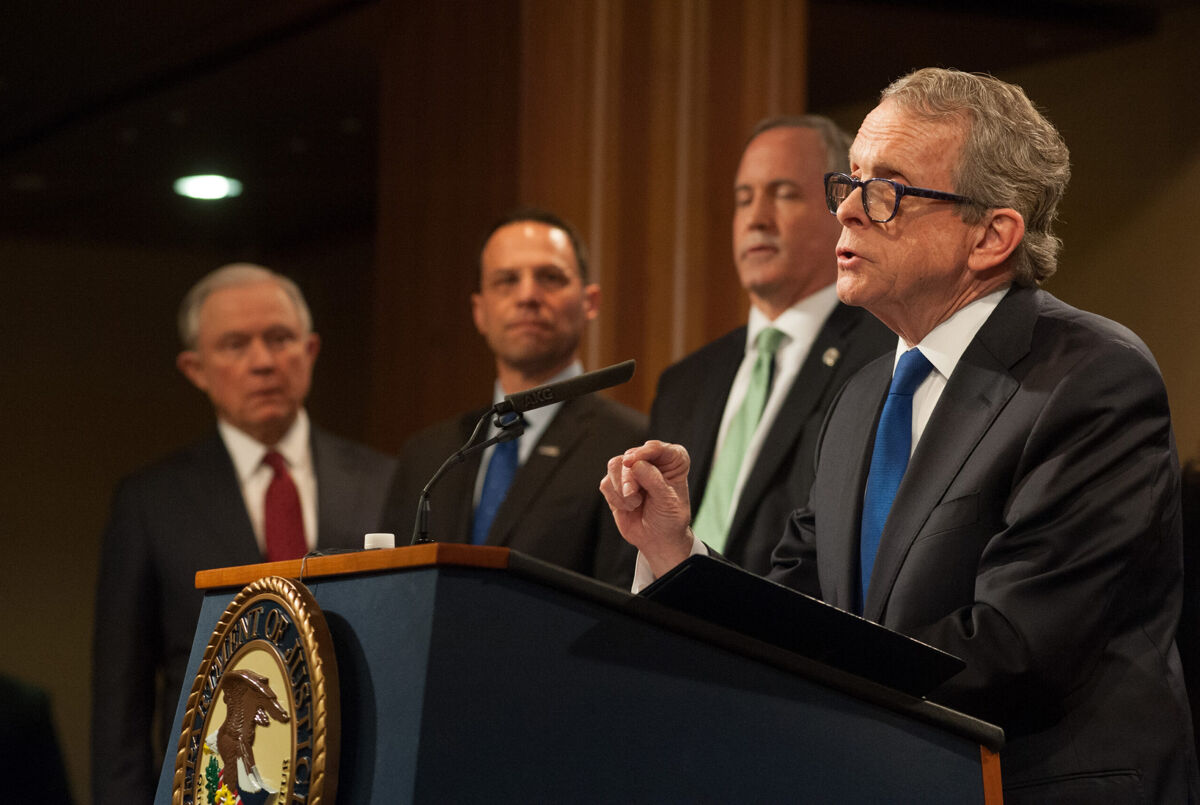 Gov. Mike DeWine delivers remarks at the Department of Justice alongside Attorney General Jeff Sessions, Pennsylvania Attorney General Josh Shapiro, and Texas Attorney General Ken Paxton in 2018.