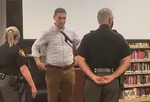 GOP candidate humiliated as police haul him out of school board meeting after trans kids rant