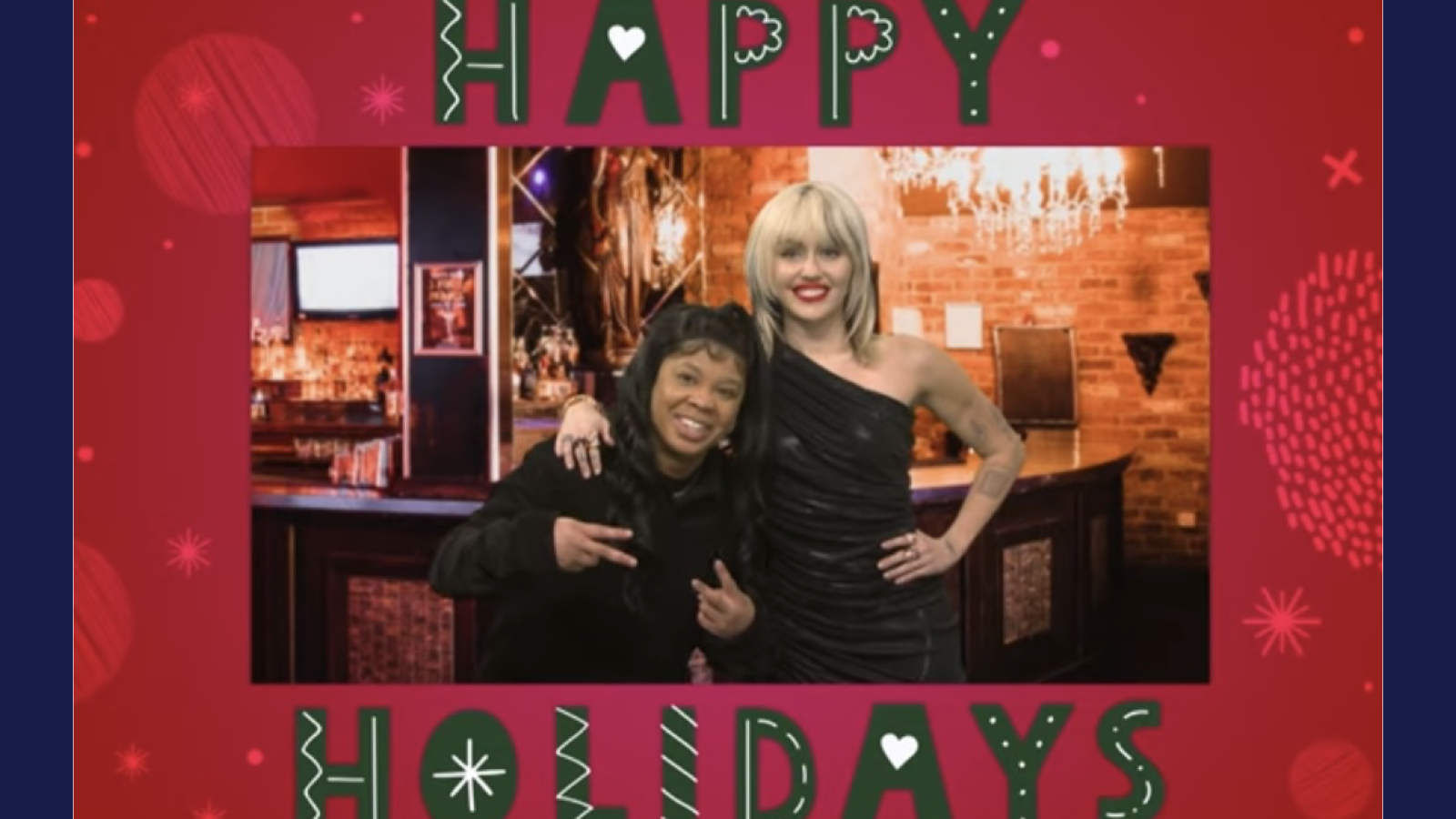 Punkie Johnson (left) poses with Miley Cyrus (right) in a Christmas card in one 'SNL' sketch