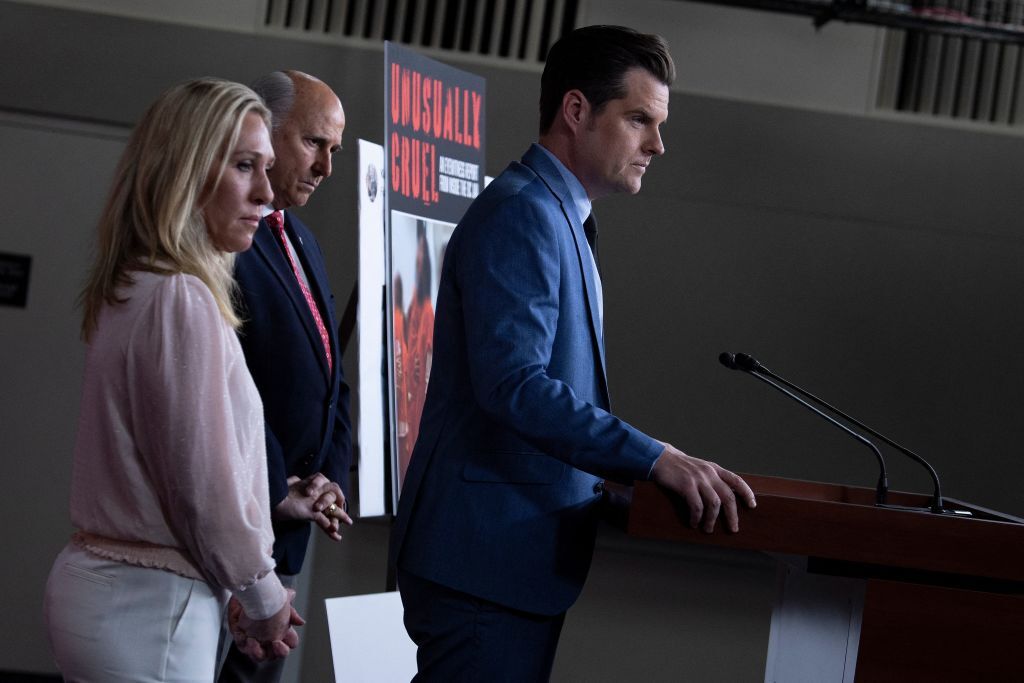 US Republican Representative Matt Gaetz, with colleagues Marjorie Taylor Greene (L) and Louie Gohmert, speaks at a press conference addressing the treatment of the January 6th detainees at the DC Jail, on Capitol Hill, December 7, 2021, in Washington, DC. (Photo by Brendan Smialowski / AFP) (Photo by BRENDAN SMIALOWSKI/AFP via Getty Images)