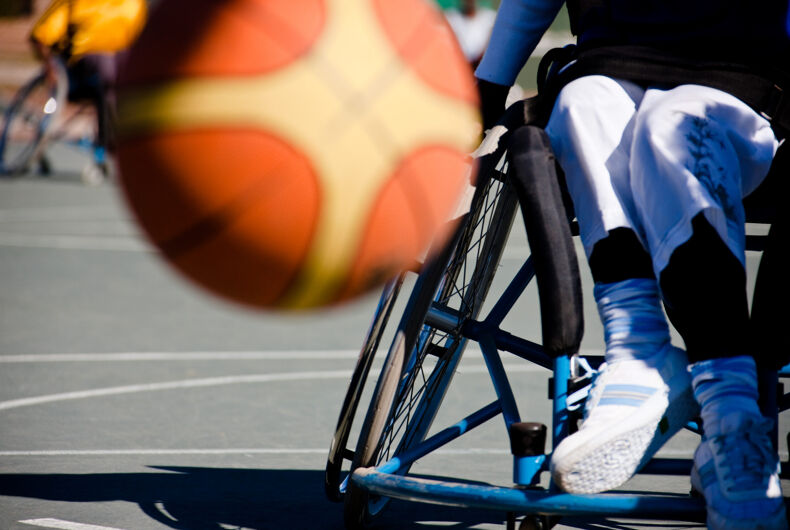 Basketball player in the wheelchair, motion blur on ball