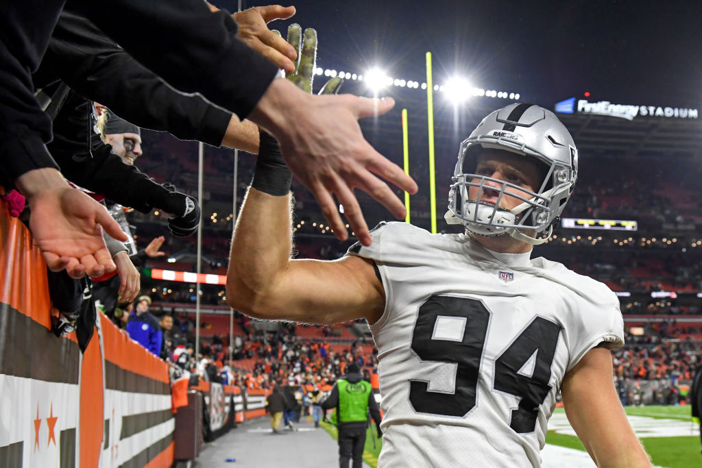 Carl Nassib #94 of the Las Vegas Raiders celebrates with fans after the Raiders defeated the Cleveland Browns 16-14 at FirstEnergy Stadium in Cleveland, Ohio.