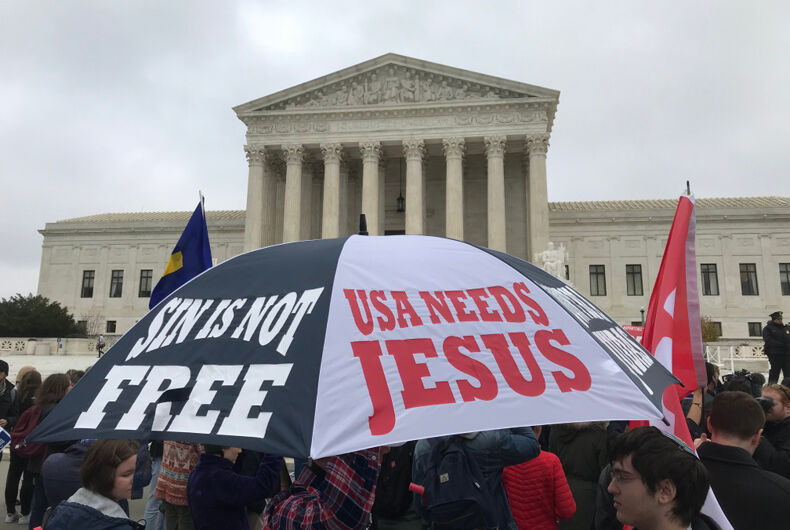 December 5, 2017-Umbrella with religious messages being displayed at the Supreme Court in support of Masterpiece Cakeshop