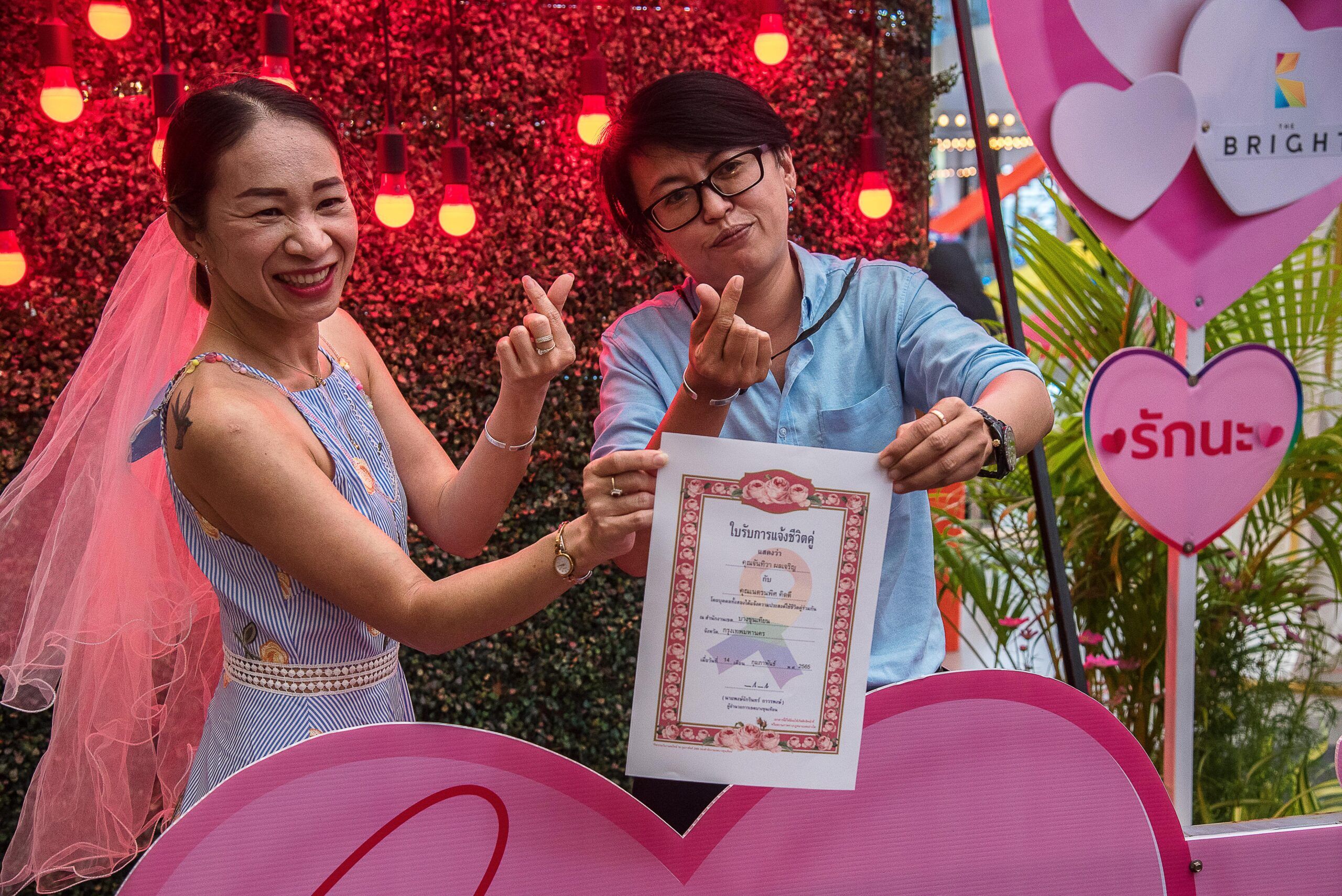 A Thai LGBTQ couple show their marriage certificate during the Marriage registration event hosted by the Bang Khun Thian District on Valentines Day in Bangkok. The Bang Khun Thian District Office organized a marriage registration event for LGBTQ couples, which is the first time in Thailand to promote and support equal marriage in Thailand. The marriage registration of LGBTQ couples is not yet legal as Thailand's equal marriage law has not been passed by Parliament.