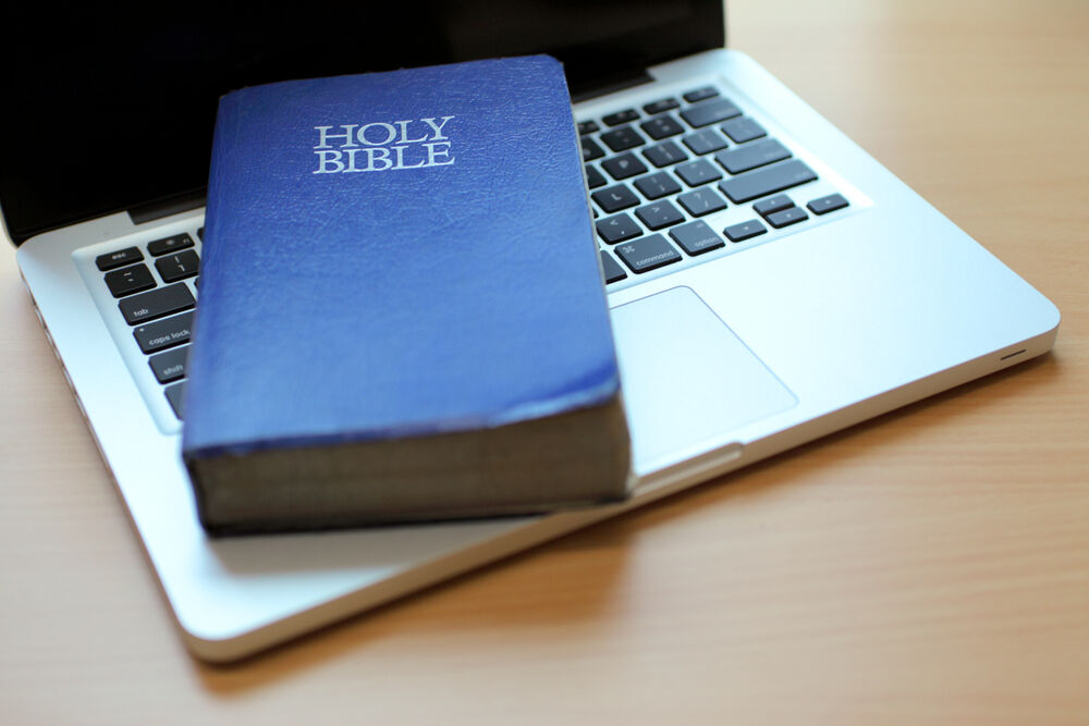 A Bible on a laptop