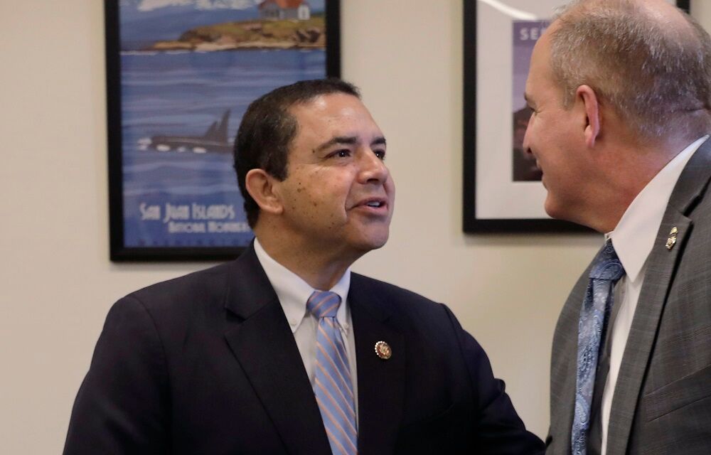 Rep. Henry Cuellar, left, greets U.S. Customs and Border Protection Acting Commissioner Mark Morgan